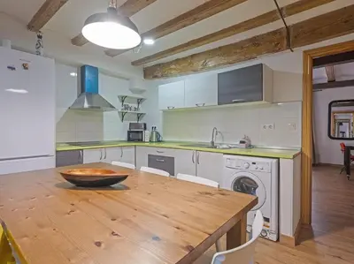 a kitchen with a wooden table with a bowl on it at Las Ramblas, comfort in BCN for 8 persons in Barcelona