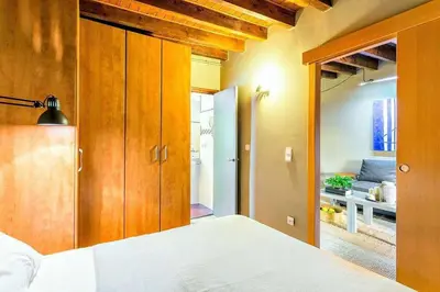 a kitchen with a stainless steel refrigerator at The Collection Barcelona - Paseo de Gracia sunny 2BR penthouse in Barcelona