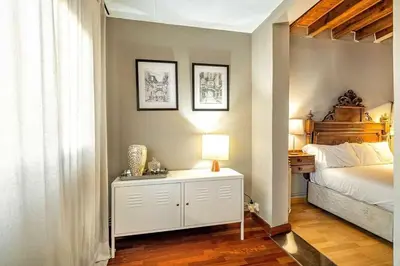 a living room with a hallway with a television and a room at The Collection Barcelona - Paseo de Gracia sunny 2BR penthouse in Barcelona