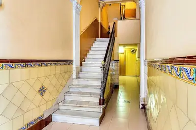 a hallway with stairs in a building at The Collection Barcelona - Paseo de Gracia sunny 2BR penthouse in Barcelona