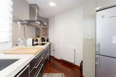 a kitchen with a sink and a counter top at Canela Homes BARCELONA OLYMPIC in Barcelona