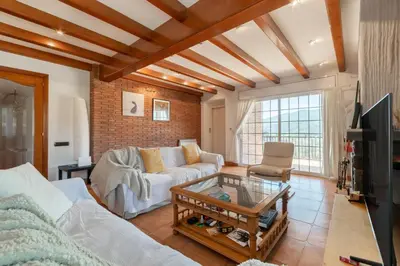 a living room with a couch and a table at Large 5-Bed Villa, mountain and beach, at 30' from Barcelona & 10' from F1 Circuit in Vallromanas