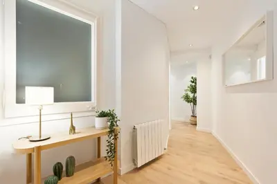 a bathroom with a sink and a shower and a mirror at Suites Barcelona Park Güell in Barcelona