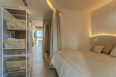 a bedroom with a bed and a book shelf at Apartamentos Azul in Castelldefels
