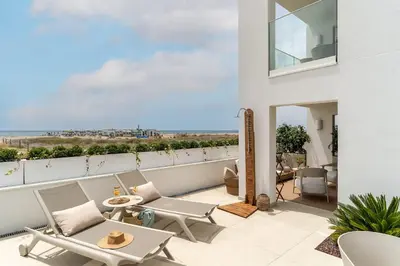 a balcony with a view of the ocean at Apartamentos Azul in Castelldefels