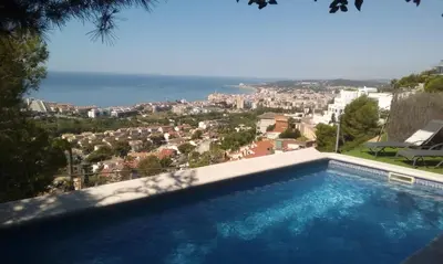 a swimming pool with a view of the city at The Villa Sunlight in Sitges