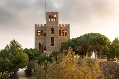 a building with a tower with lights on it at Loft Rural Barcelona in Barcelona