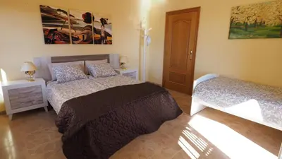 a bedroom with two beds in a room at Villa Antonia in Mataró