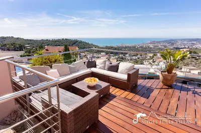 a bedroom with a white bed and a large window at Stylish Villa Havana with Sea Views, Private Pool & A/C in Sitges