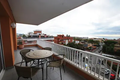 a balcony with a table and chairs and a view at Narciso views in Vilassar de Mar