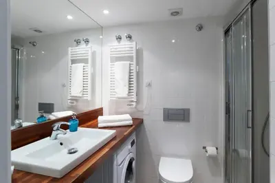 a bathroom with a sink and a toilet and a shower at Central Verdete in Barcelona