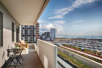 a balcony with a view of a city at Seaside Badalona Apartment in Badalona
