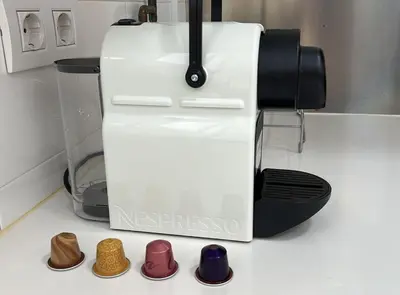 a coffee maker and some shoes on a counter at BALMES - Atico con terraza en Sant Gervasi in Barcelona
