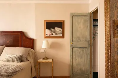a bedroom with a bed and a picture on the wall at Casa Victor Riu in Piera