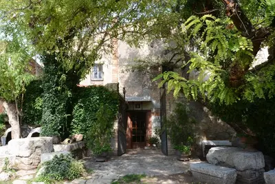 an entrance to an old building with a door at El Recer in Sant Pau dʼOrdal