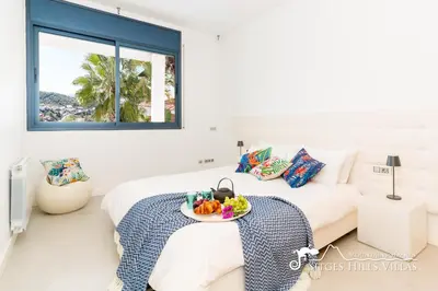 a staircase in a living room with green and white stairs at Super Villa Oasis Fab Sea and Sitges View with Private Pool and Air Conditioning in Sitges