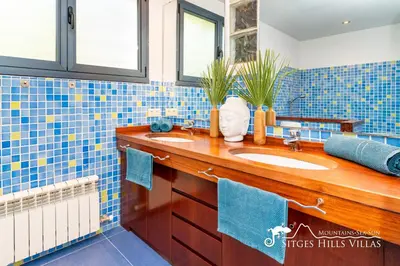 a kitchen with a table with fruit on it at Super Villa Oasis Fab Sea and Sitges View with Private Pool and Air Conditioning in Sitges