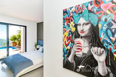 a bedroom with a white bed and a window at Super Villa Oasis Fab Sea and Sitges View with Private Pool and Air Conditioning in Sitges