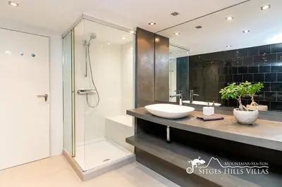 a bathroom with a sink and a shower at Super Villa Oasis Fab Sea and Sitges View with Private Pool and Air Conditioning in Sitges