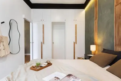 a table with a bowl of fruit and orange juice at Bantu - 1 bedroom and balcony in Eixample Esquerra in Barcelona