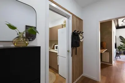 a bathroom with a tub and a sink and a toilet at Bantu - 1 bedroom and balcony in Eixample Esquerra in Barcelona