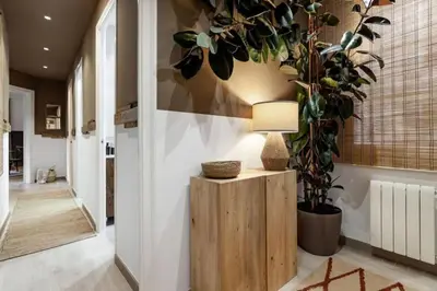 a living room with a television and a table at Vili - 2 bedrooms and balcony in Sant Antoni in Barcelona