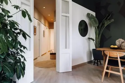 a room with a desk with two chairs and a mirror at Bari - 2 bedroom and office in Sant Antoni in Barcelona
