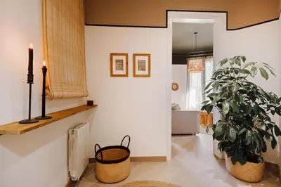 an office with a desk with a laptop and chairs at Bari - 2 bedroom and office in Sant Antoni in Barcelona