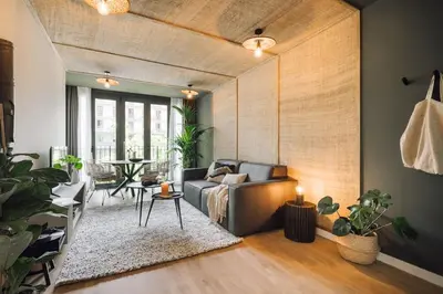 a living room with a couch and a table at Tagbu - 2 bedroom and balcony in Eixample Dreta in Barcelona