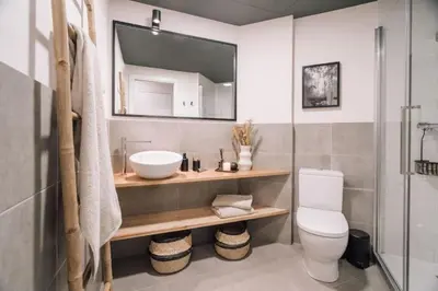 a living room with a couch and a tv at Tagbu - 2 bedroom and balcony in Eixample Dreta in Barcelona
