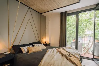 a kitchen with white cabinets and a sink at Tagbu - 2 bedroom and balcony in Eixample Dreta in Barcelona