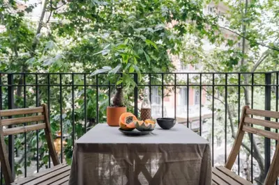 a dining room with a table and chairs at Tagbu - 2 bedroom and balcony in Eixample Dreta in Barcelona