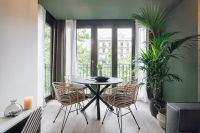a bedroom with a large bed with a large wall at Tagbu - 2 bedroom and balcony in Eixample Dreta in Barcelona