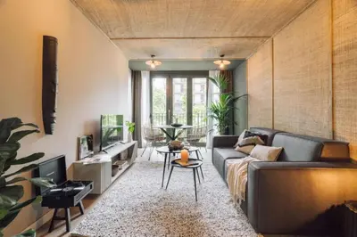 a bedroom with a large bed with a large window at Tagbu - 2 bedroom and balcony in Eixample Dreta in Barcelona