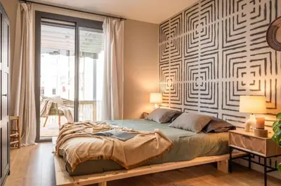 a kitchen with white cabinets and a sink at Lulua - 2 bedrooms in Eixample Dreta in Barcelona