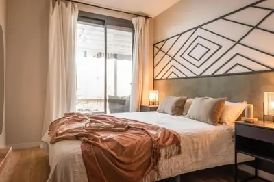 a living room with a table and a couch at Lulua - 2 bedrooms in Eixample Dreta in Barcelona