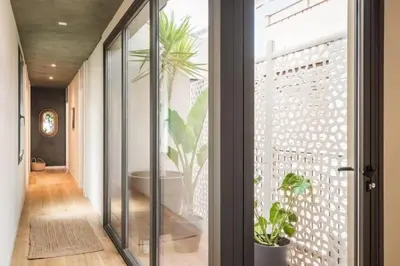 a bedroom with a large bed with a large window at Lulua - 2 bedrooms in Eixample Dreta in Barcelona
