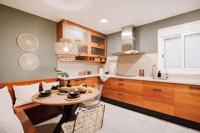 a bedroom with a bed and a table with a lamp at Yulu - 3 bedrooms and balcony in Eixample Dreta in Barcelona