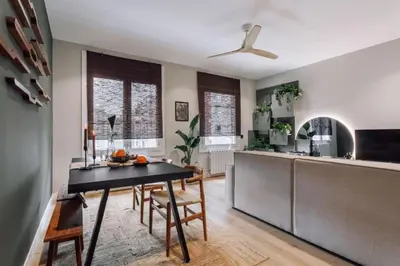 a hallway with two potted plants in a house at Songe - 2 bedroom in Eixample Esquerra in Barcelona