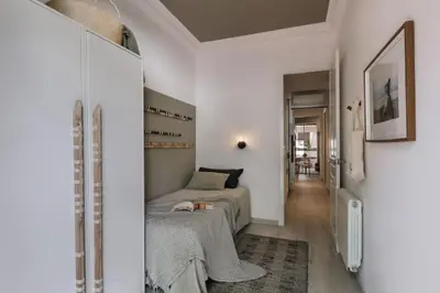 a bedroom with a large bed and a large window at Bambuti - 3 bedrooms and balcony in Passeig Sant Joan in Barcelona