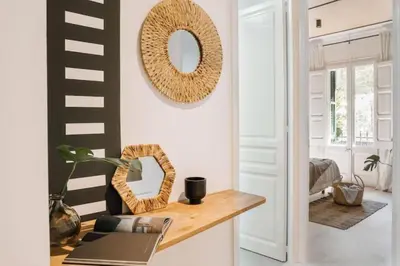 a bedroom with a large bed with two lamps at Bambuti - 3 bedrooms and balcony in Passeig Sant Joan in Barcelona