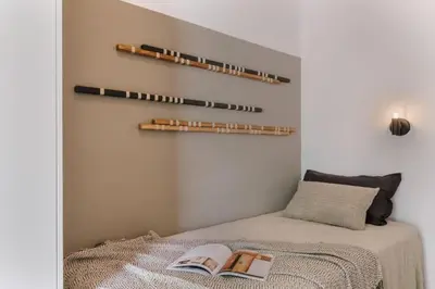 a bedroom with a bed and a large window at Bambuti - 3 bedrooms and balcony in Passeig Sant Joan in Barcelona