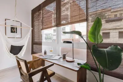 a bedroom with a bed with two books on it at Bambuti - 3 bedrooms and balcony in Passeig Sant Joan in Barcelona
