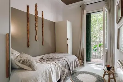 a counter with a microwave and a toaster oven on it at Zioba - 3 bedroom and balcony in Gracia in Barcelona