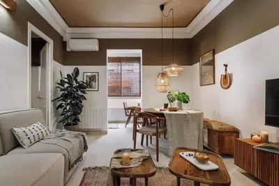 a living room with a couch and a table at Zioba - 3 bedroom and balcony in Gracia in Barcelona