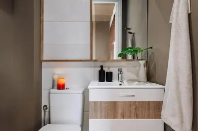 a bedroom with a bed with a curtain and two lamps at Zioba - 3 bedroom and balcony in Gracia in Barcelona