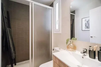 a living room with a couch and a table at Bolia - 2 bedrooms in Eixample Esquerra in Barcelona