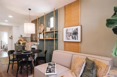 a white room with a desk and a closet at Bolia - 2 bedrooms in Eixample Esquerra in Barcelona