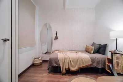 a patio with a wooden pergola and a table and chairs at Bolia - 2 bedrooms in Eixample Esquerra in Barcelona