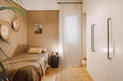 a kitchen with a table and chairs in a room at Babinga - 3 bedroom and balcony in Eixample Esquerra in Barcelona
